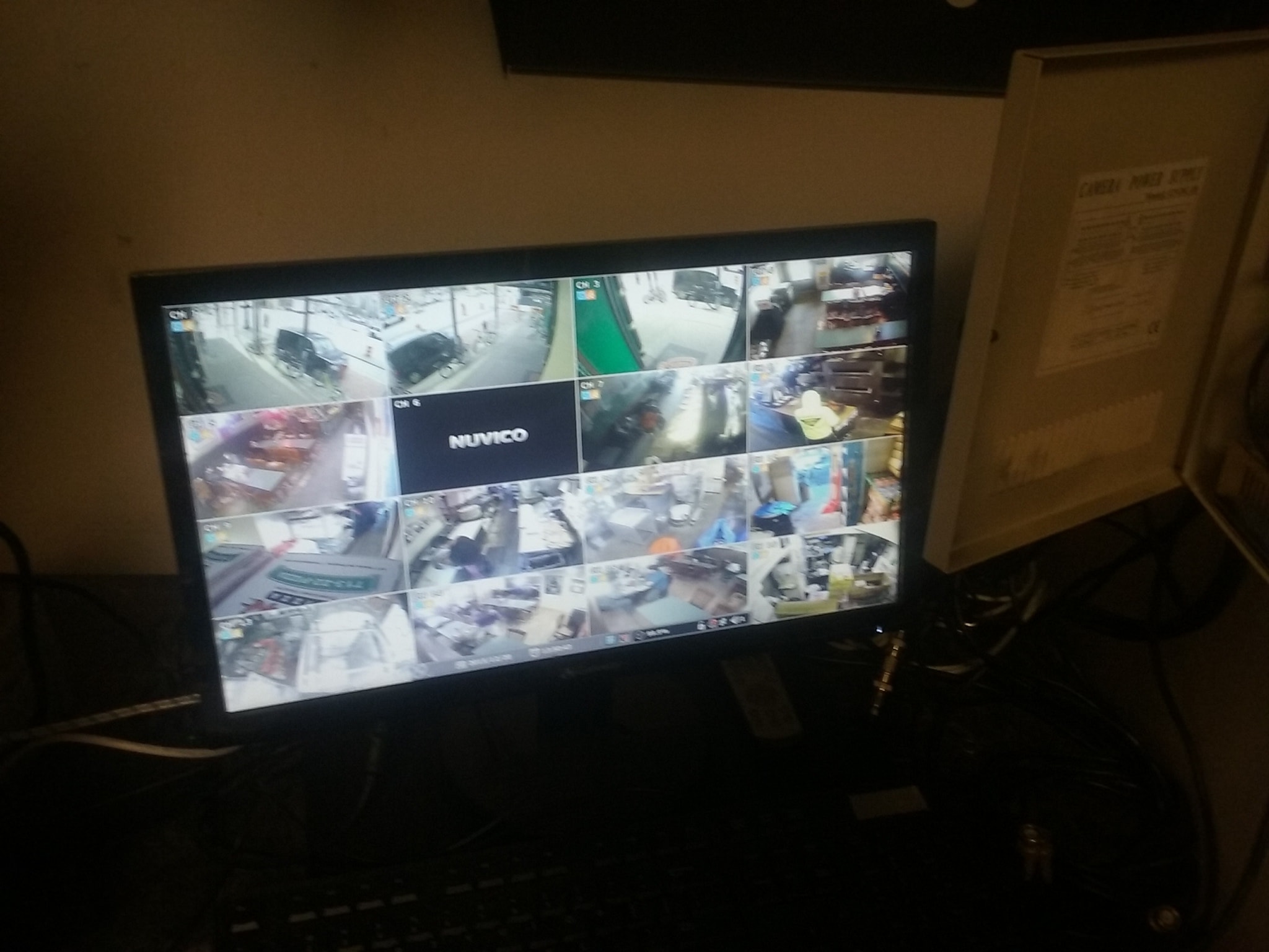 Security camera monitor displaying multiple camera feeds