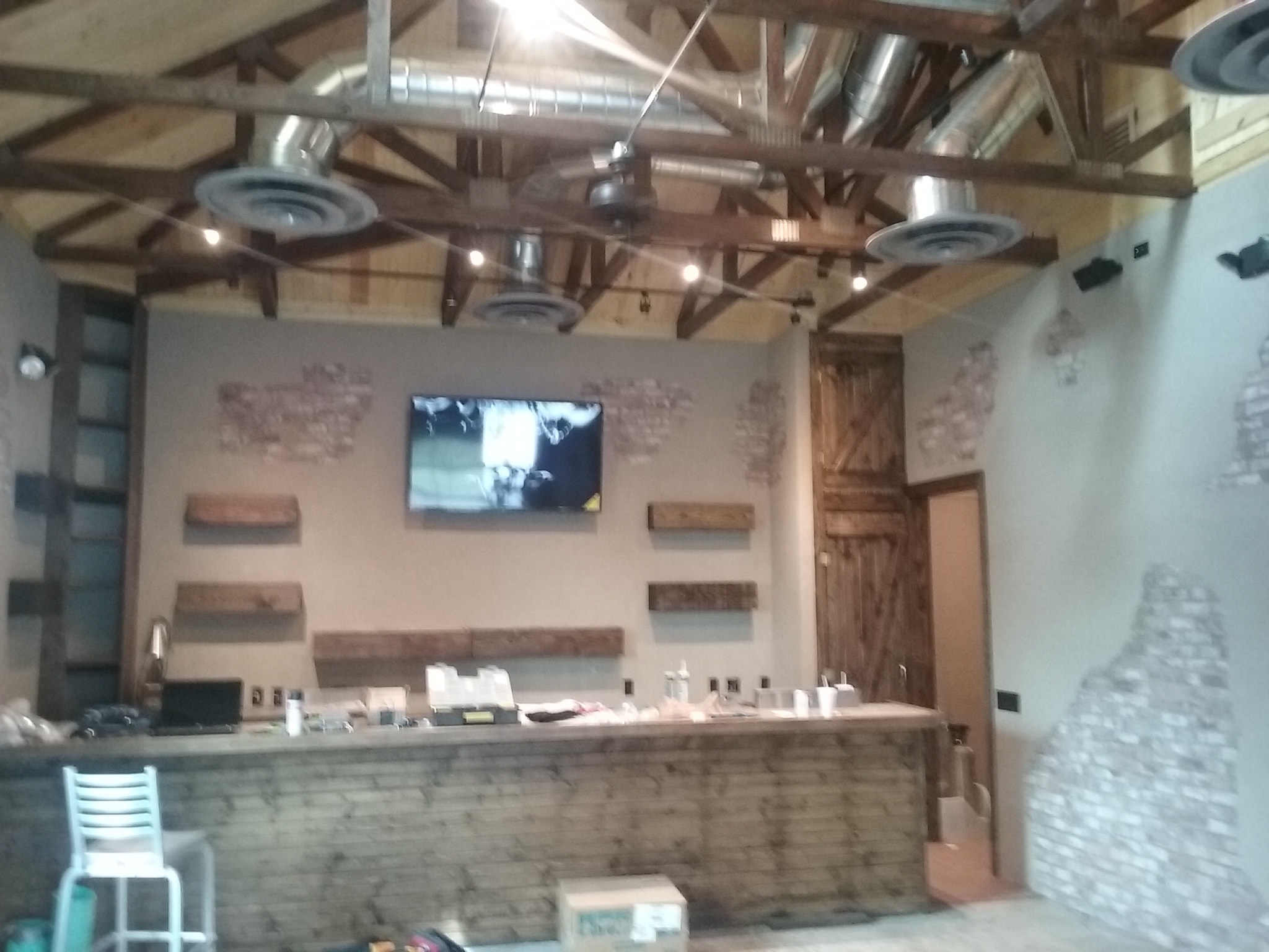 Modern restaurant interior with counter display and AV integration