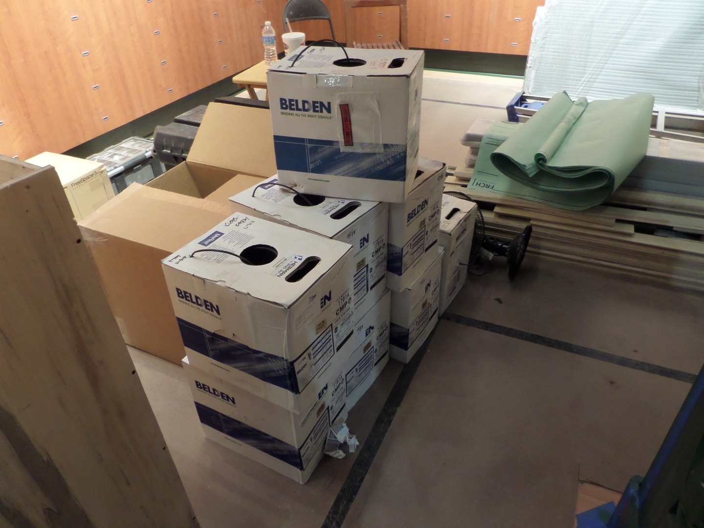 Stacked Belden cable boxes — structured cabling supply for large AV project