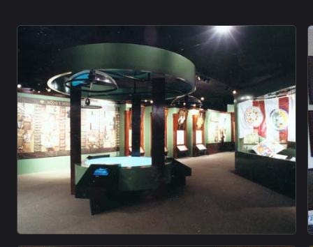 Museum kiosk with interactive displays, circular architecture and exhibit lighting