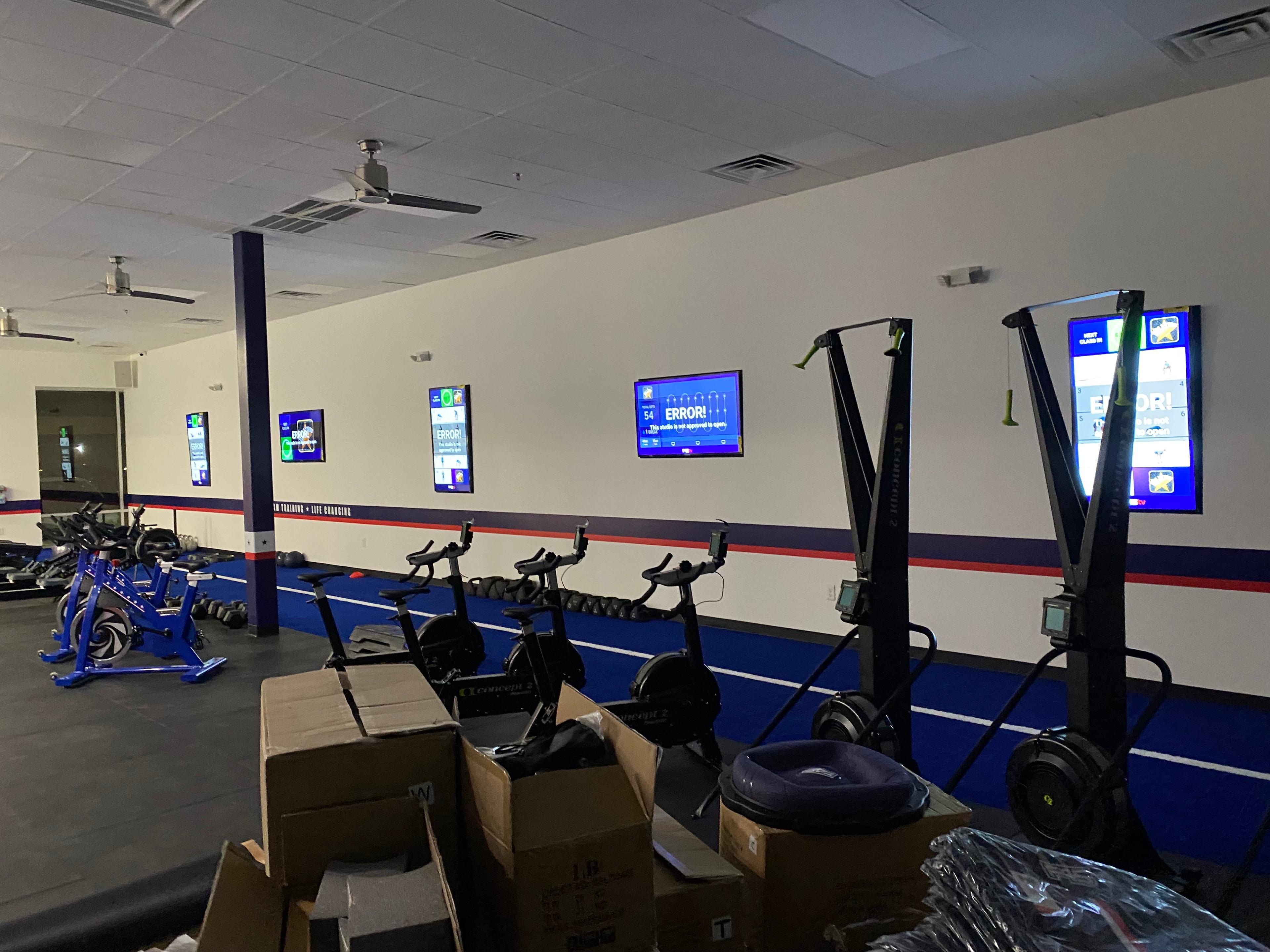 Indoor gym with exercise bikes and equipment — commercial AV project