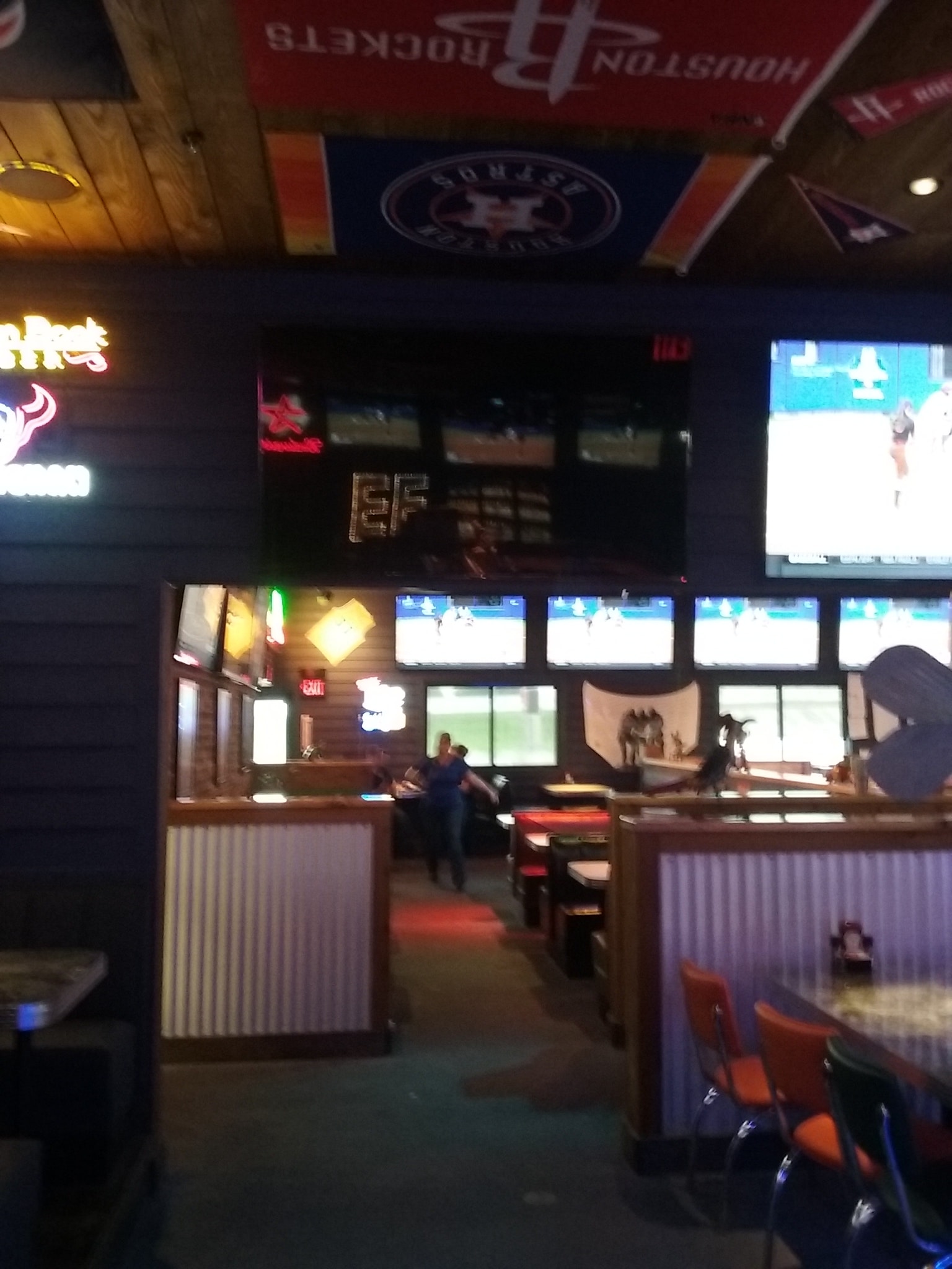 Sports bar interior with multiple screens and structured cabling