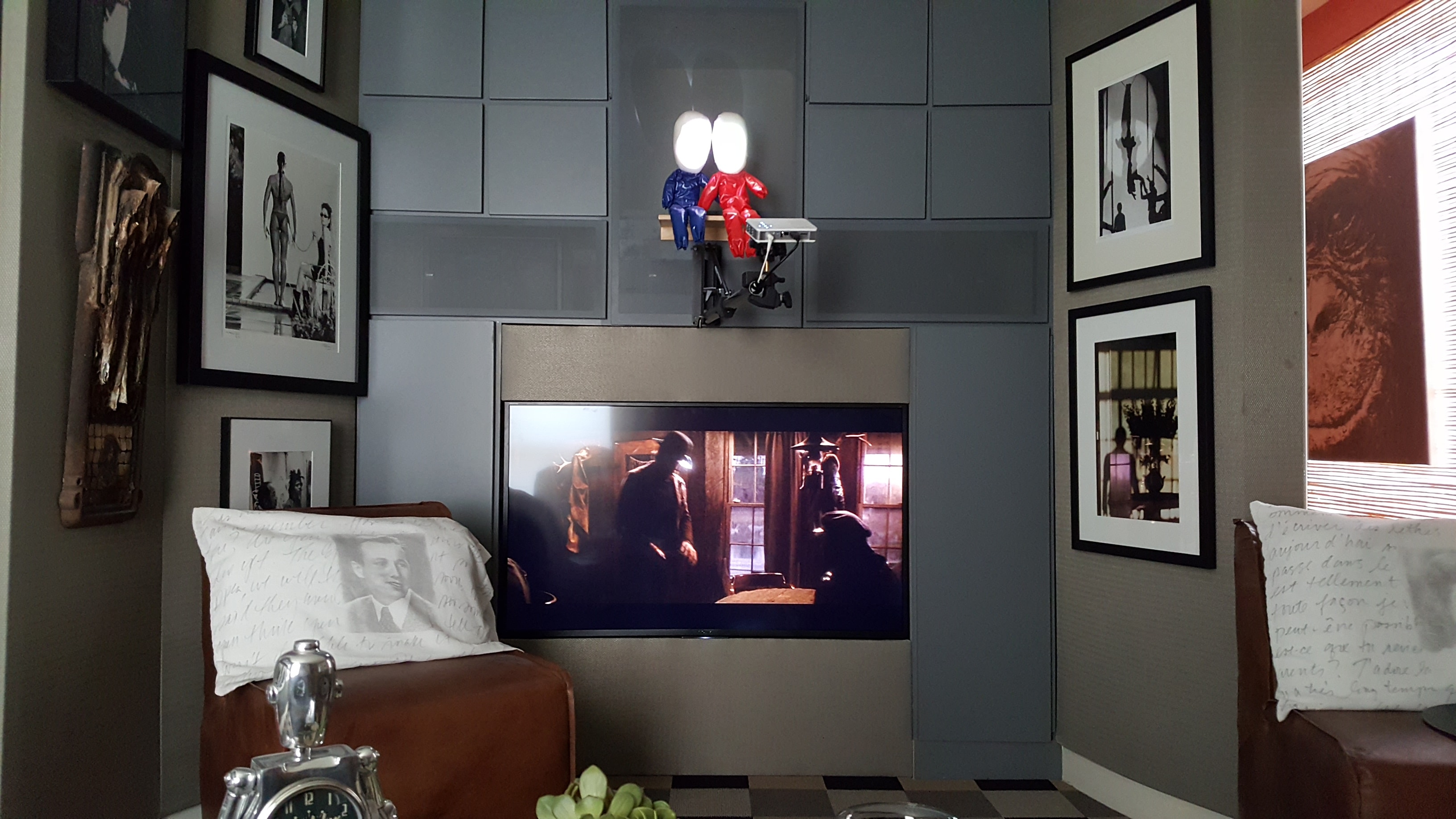 Modern living room with wall-mounted TV display and AV system